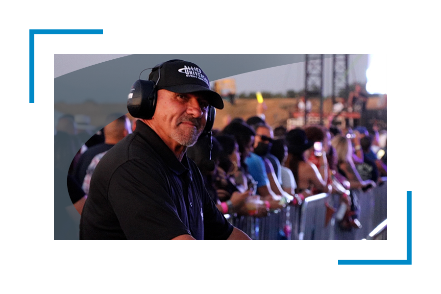 Allied Universal security professional wearing headphones supporting event security services and coordinating with event management consultants