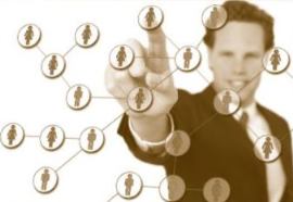 man touching computer screen with people icons