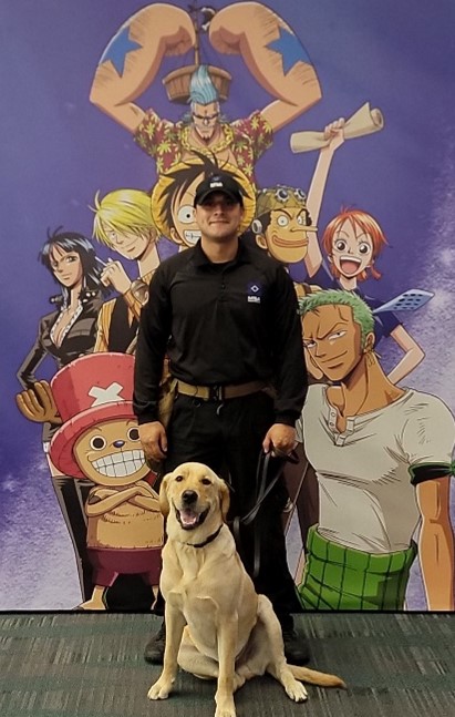 A person standing next to a dog