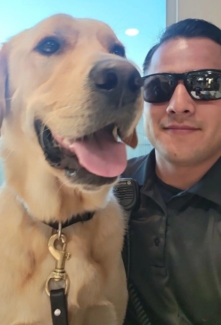 A person taking a selfie with a dog