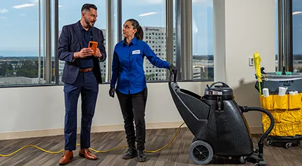 man and woman standing in office, janitorial services